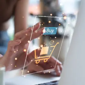 Hand interacting with virtual shopping cart interface.